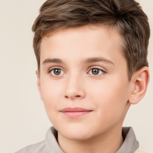 Joyful white child male with short  brown hair and brown eyes