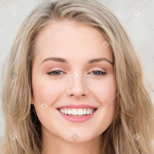 Joyful white young-adult female with long  brown hair and blue eyes