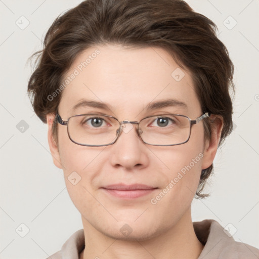 Joyful white young-adult female with short  brown hair and grey eyes