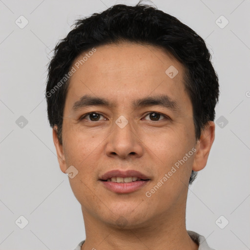 Joyful asian adult male with short  black hair and brown eyes