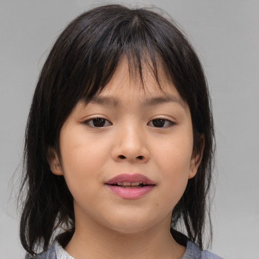 Joyful asian child female with medium  brown hair and brown eyes
