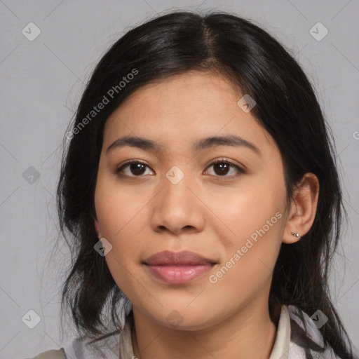 Joyful latino young-adult female with medium  black hair and brown eyes