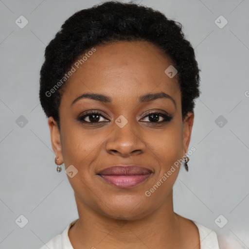 Joyful black young-adult female with short  black hair and brown eyes