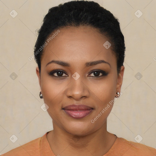 Joyful black young-adult female with short  black hair and brown eyes