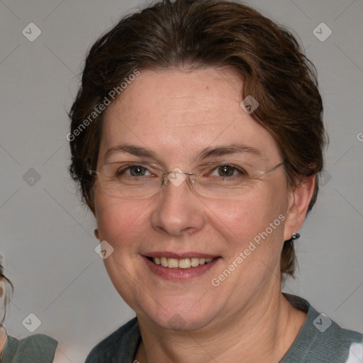 Joyful white adult female with medium  brown hair and blue eyes