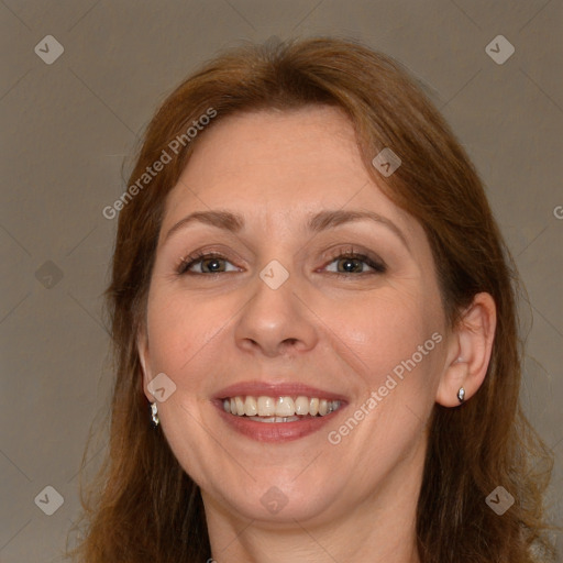 Joyful white adult female with long  brown hair and brown eyes