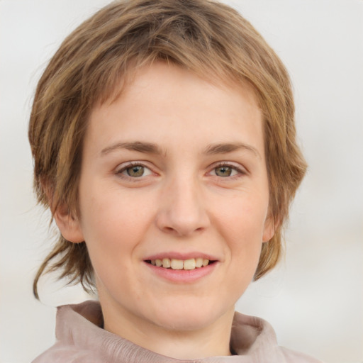 Joyful white young-adult female with medium  brown hair and green eyes