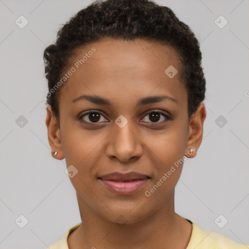 Joyful black young-adult female with short  black hair and brown eyes