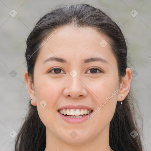 Joyful white young-adult female with long  brown hair and brown eyes