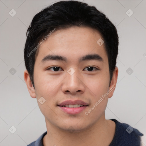 Joyful asian young-adult male with short  black hair and brown eyes