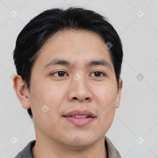 Joyful asian young-adult male with short  brown hair and brown eyes