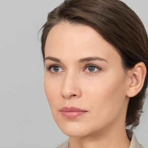 Neutral white young-adult female with medium  brown hair and brown eyes