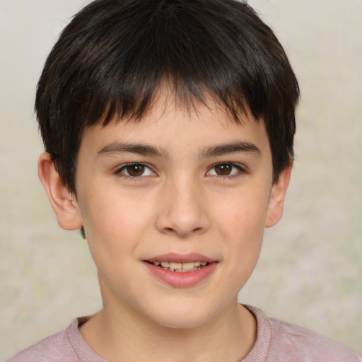 Joyful white child male with short  brown hair and brown eyes