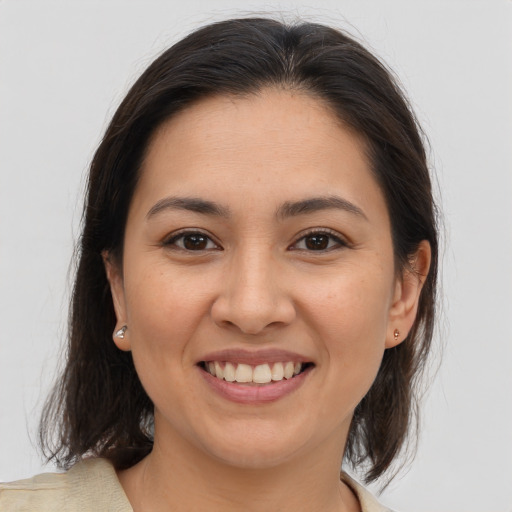 Joyful white young-adult female with medium  brown hair and brown eyes
