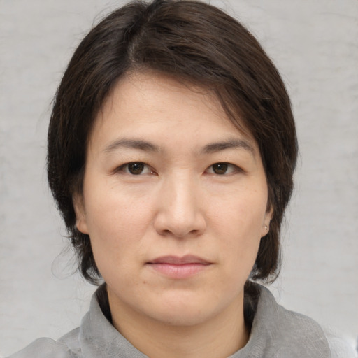 Neutral white young-adult female with medium  brown hair and brown eyes