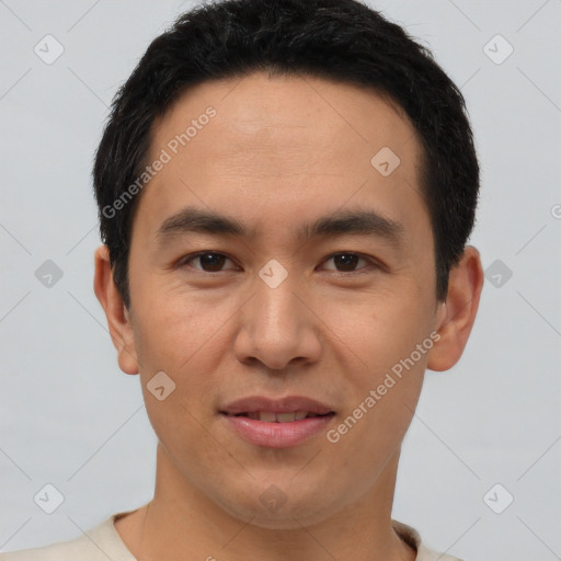 Joyful latino young-adult male with short  black hair and brown eyes