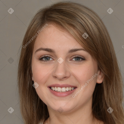 Joyful white young-adult female with long  brown hair and grey eyes