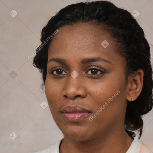 Joyful black young-adult female with medium  black hair and brown eyes