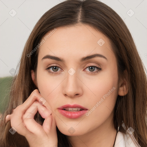 Neutral white young-adult female with long  brown hair and brown eyes