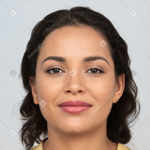 Joyful latino young-adult female with medium  brown hair and brown eyes