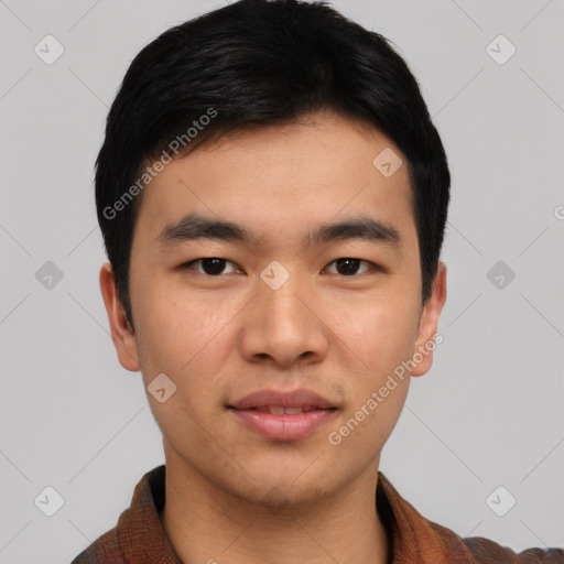 Joyful asian young-adult male with short  black hair and brown eyes