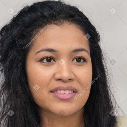 Joyful latino young-adult female with long  brown hair and brown eyes