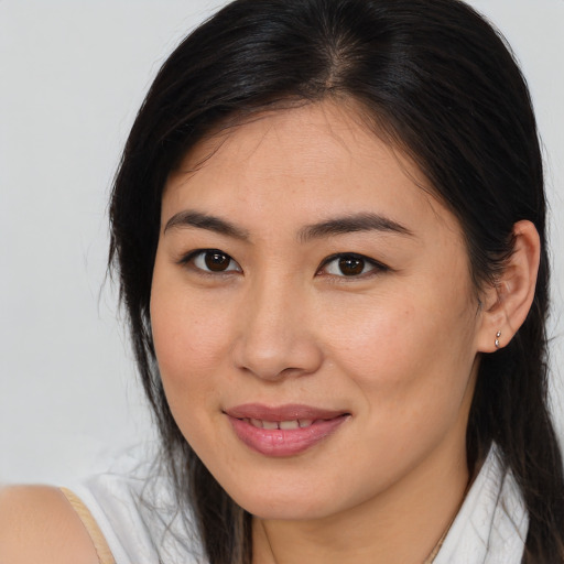 Joyful asian young-adult female with medium  brown hair and brown eyes