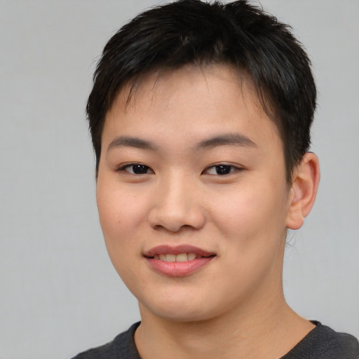 Joyful asian young-adult female with short  brown hair and brown eyes