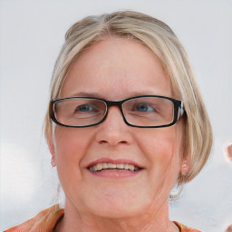 Joyful white adult female with medium  brown hair and blue eyes