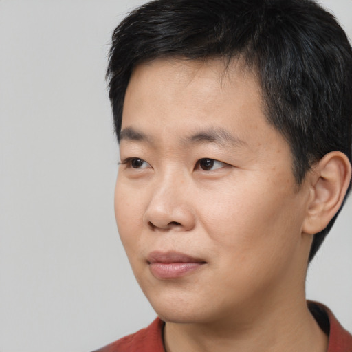 Neutral asian young-adult male with short  black hair and brown eyes