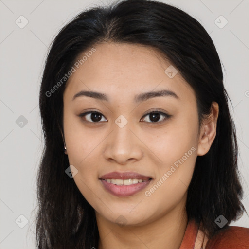 Joyful asian young-adult female with long  brown hair and brown eyes