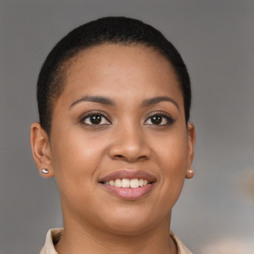 Joyful latino young-adult female with short  brown hair and brown eyes