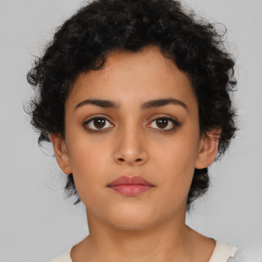 Neutral latino young-adult female with short  black hair and brown eyes