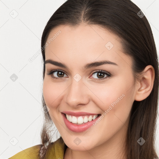 Joyful white young-adult female with long  brown hair and brown eyes