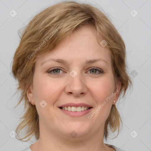 Joyful white young-adult female with medium  brown hair and blue eyes