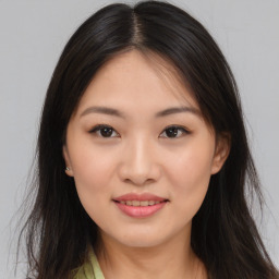 Joyful asian young-adult female with long  brown hair and brown eyes