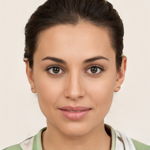 Joyful white young-adult female with medium  brown hair and brown eyes