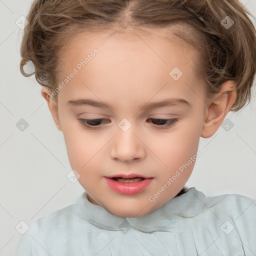 Joyful white child female with short  brown hair and brown eyes