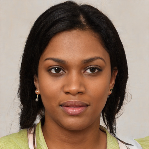 Neutral black young-adult female with medium  black hair and brown eyes