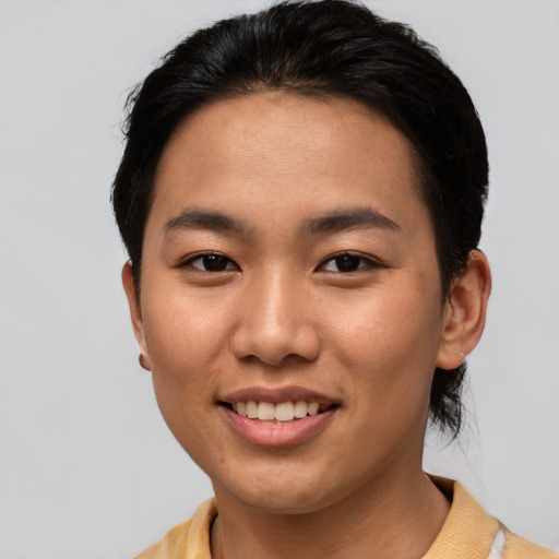 Joyful asian young-adult female with short  brown hair and brown eyes