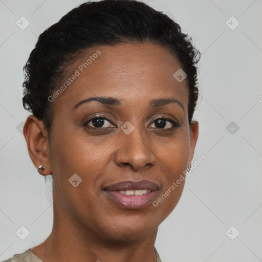 Joyful black young-adult female with short  brown hair and brown eyes