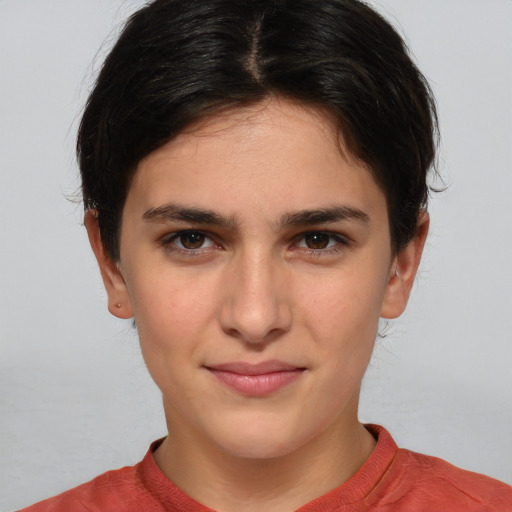 Joyful white young-adult female with short  brown hair and brown eyes