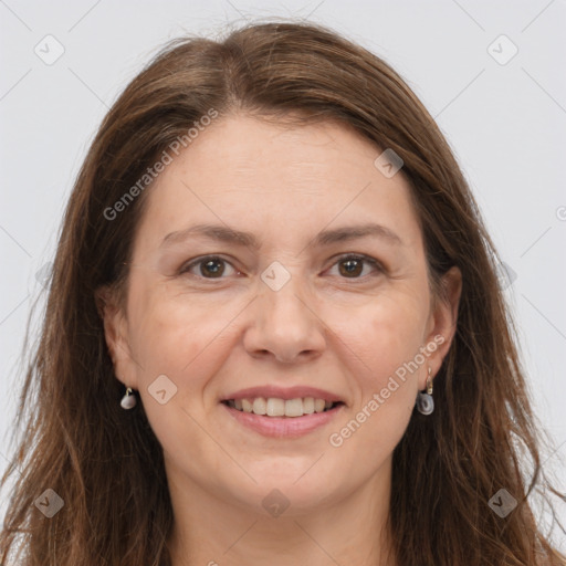 Joyful white adult female with long  brown hair and grey eyes