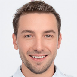 Joyful white young-adult male with short  brown hair and brown eyes