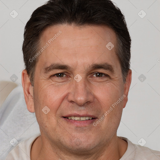 Joyful white adult male with short  brown hair and brown eyes