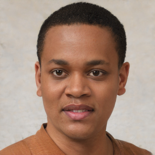 Joyful black young-adult male with short  black hair and brown eyes