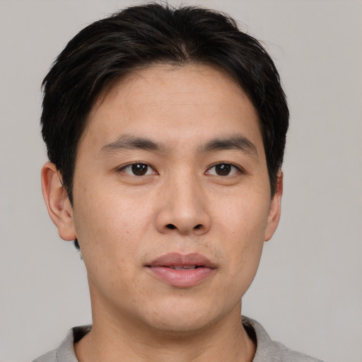 Neutral asian young-adult male with short  brown hair and brown eyes