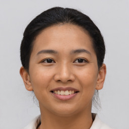 Joyful asian young-adult female with short  brown hair and brown eyes