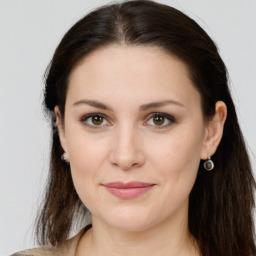 Joyful white young-adult female with long  brown hair and grey eyes