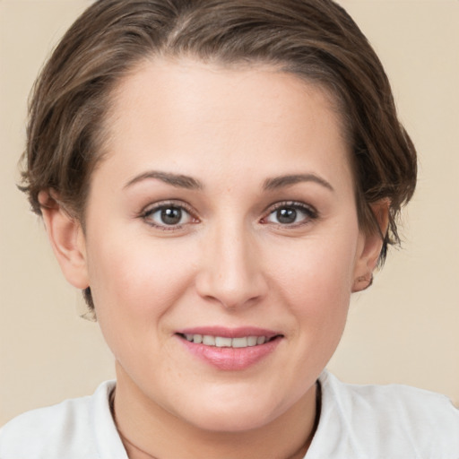 Joyful white young-adult female with medium  brown hair and brown eyes